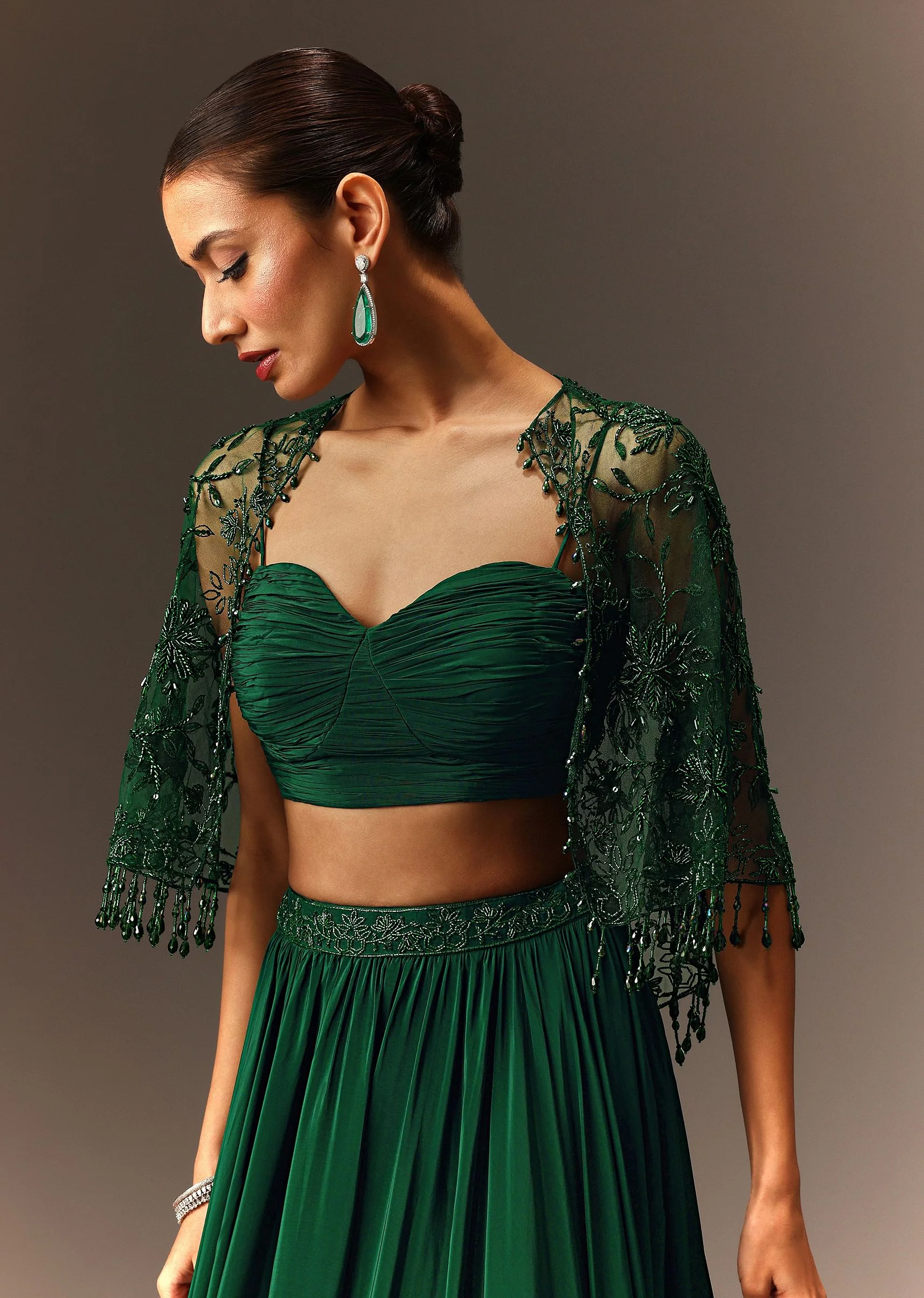 Bottle Green Tiered Lehenga With Net Cape - Image 5