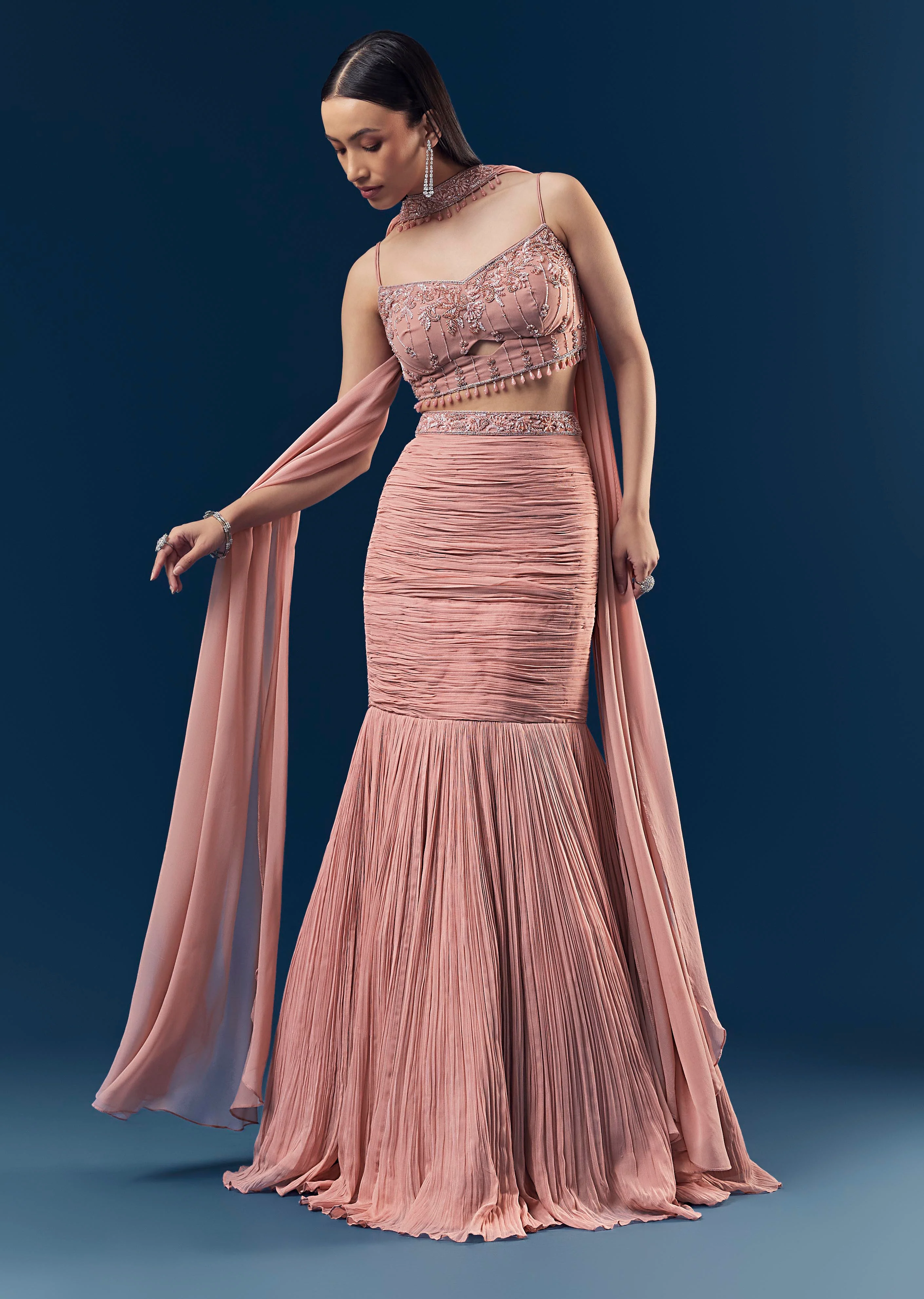Celebration Couple Set – Blush Pink Georgette Fish-Cut Lehenga with Embroidered Sleeveless Blouse & Choker Dupatta for Her And Pink Jodhpuri-Style Tuxedo Set with Metal Broach for Him - Image 3