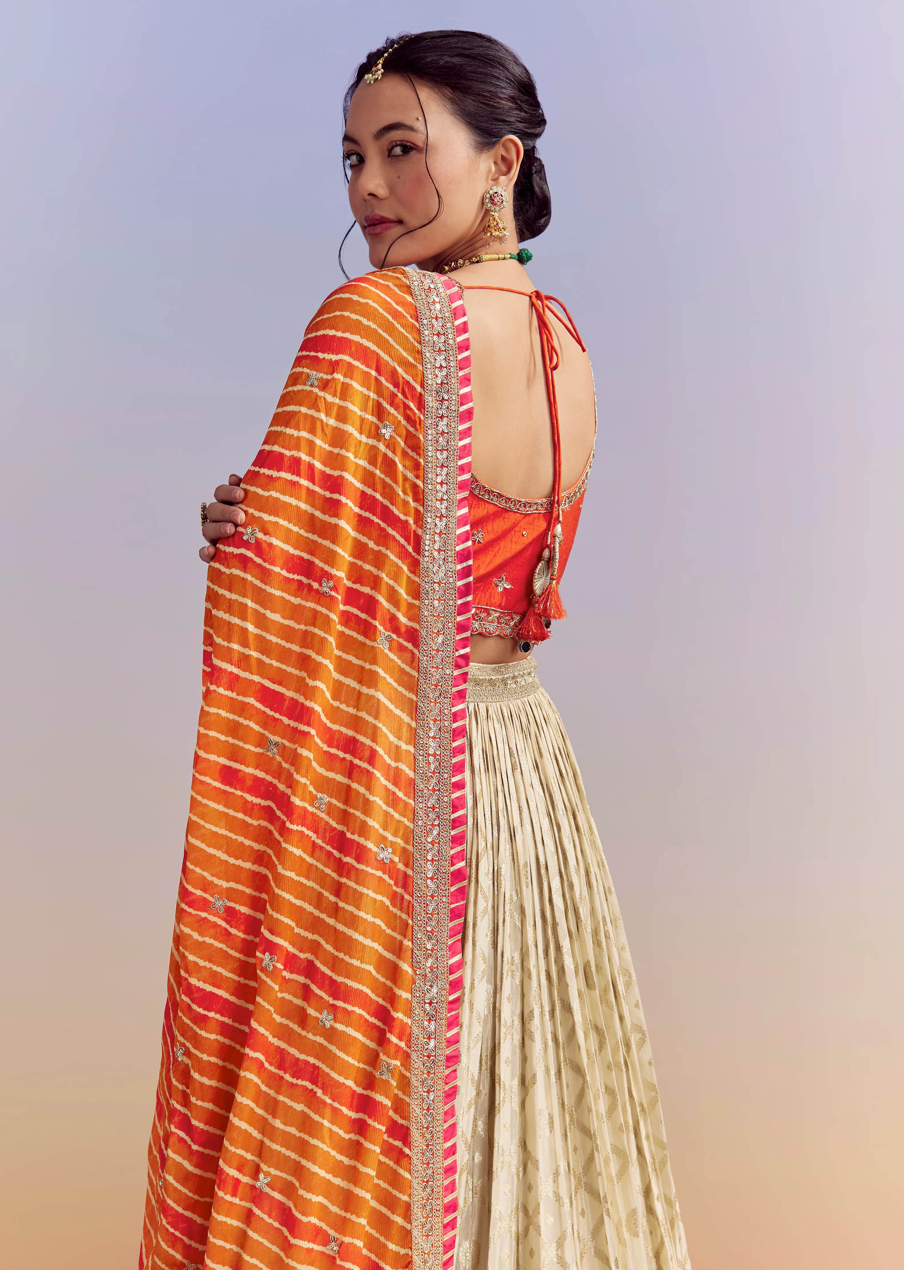 Festive Wedding Couple Set – Orange Brocade Bridesmaid Lehenga with Leheriya Dupatta for Her And Pink Embellished Tissue Kurta Set for Him - Image 6