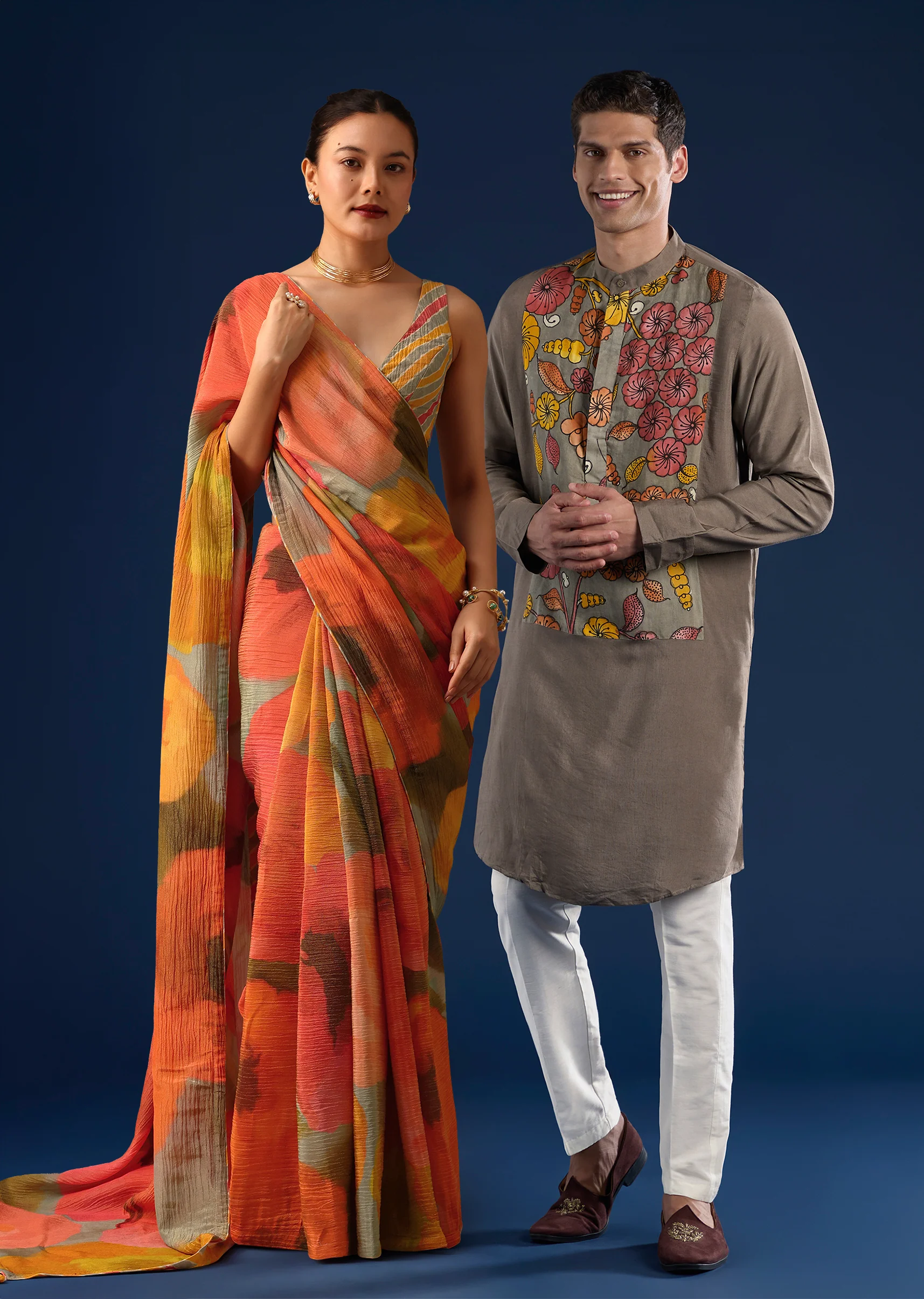 Fusion Couple Set – Orange Abstract Crush Saree for Her & Grey Handpainted Kalamkari Kurta Set for Him