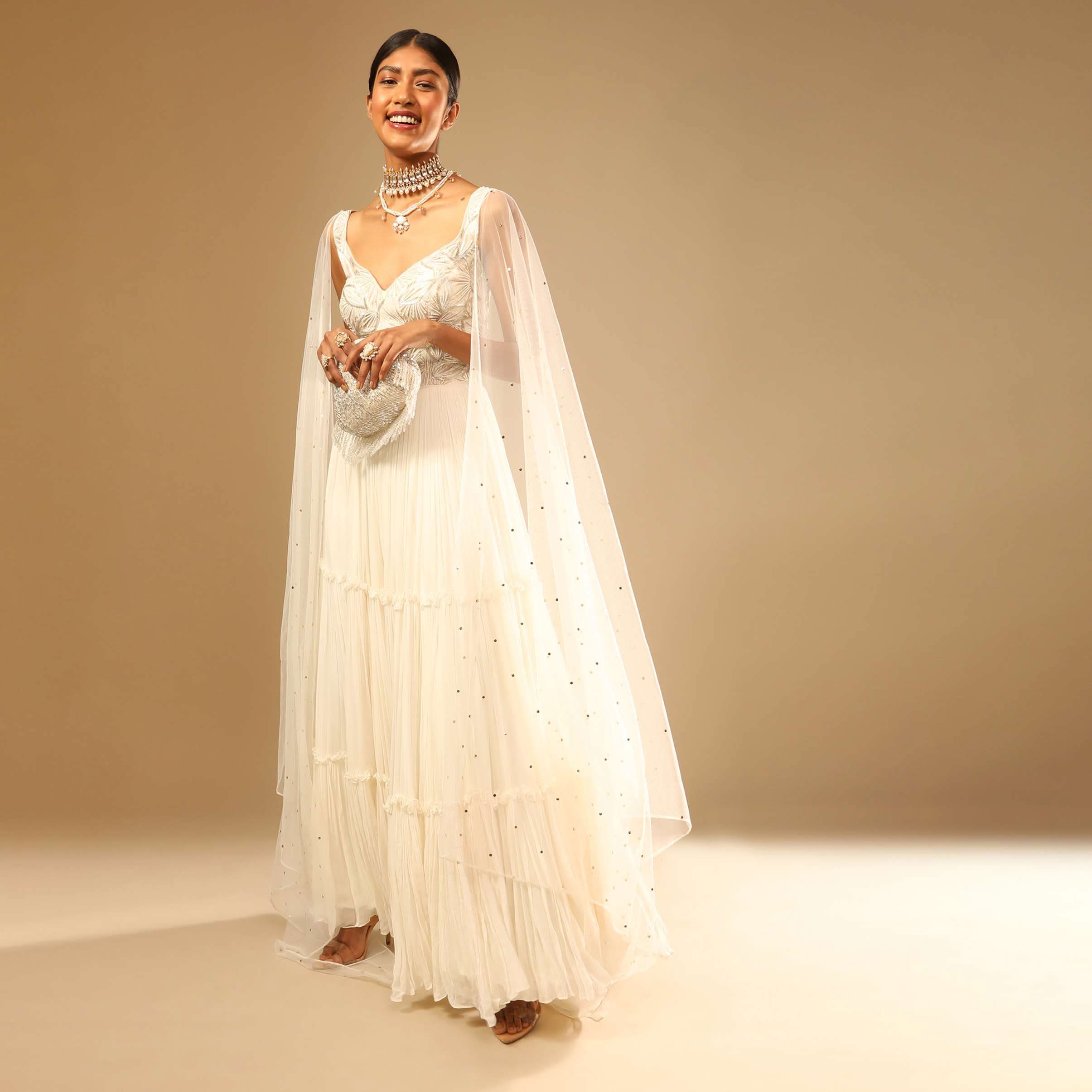 Off White Gown In Georgette With Tiered Flare And Hand Embroidered Leaf Motifs On The Bodice - Image 2