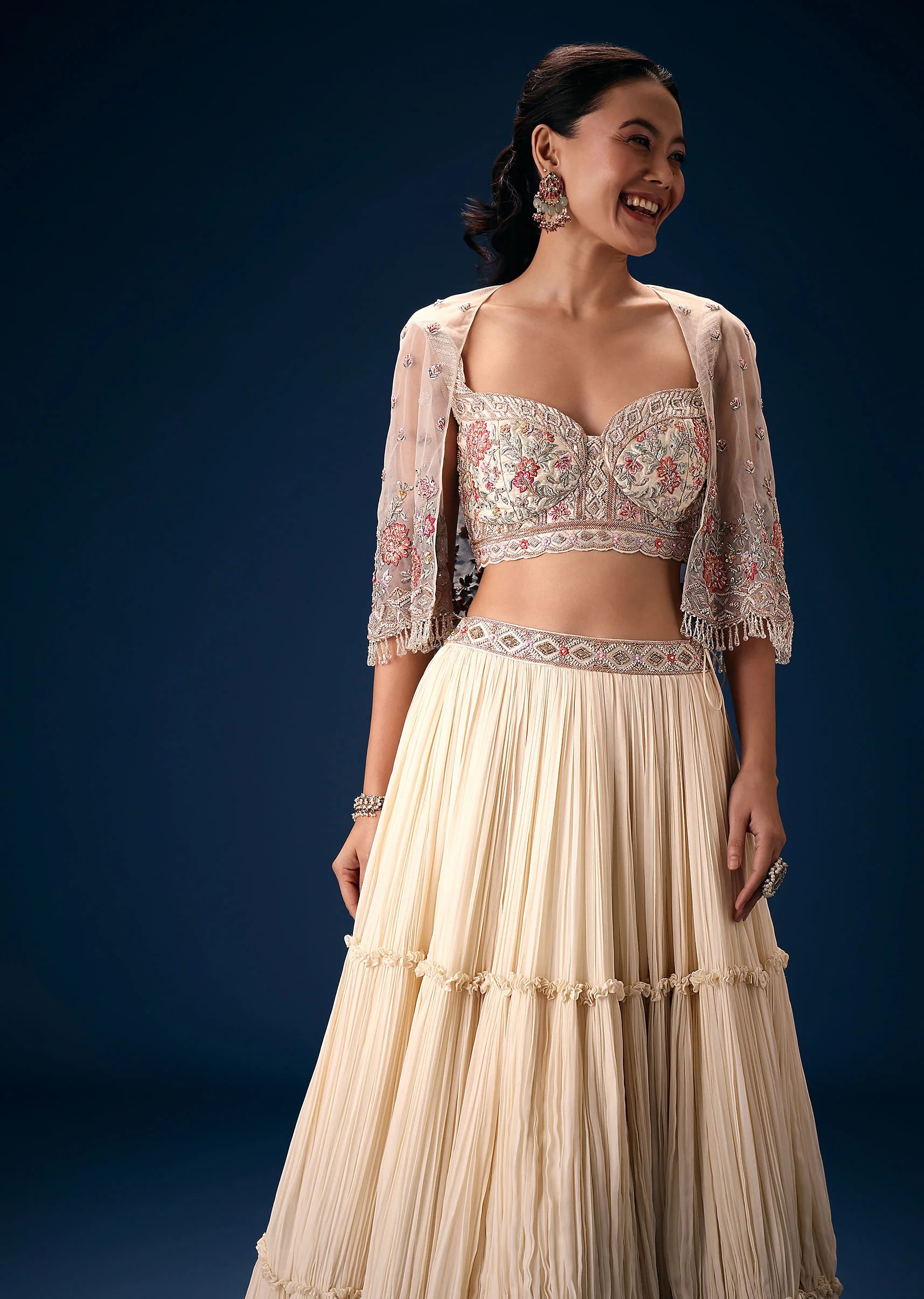 Off White Tiered Lehenga With Embroidered Corset Blouse And Embroidered Cape - Image 2
