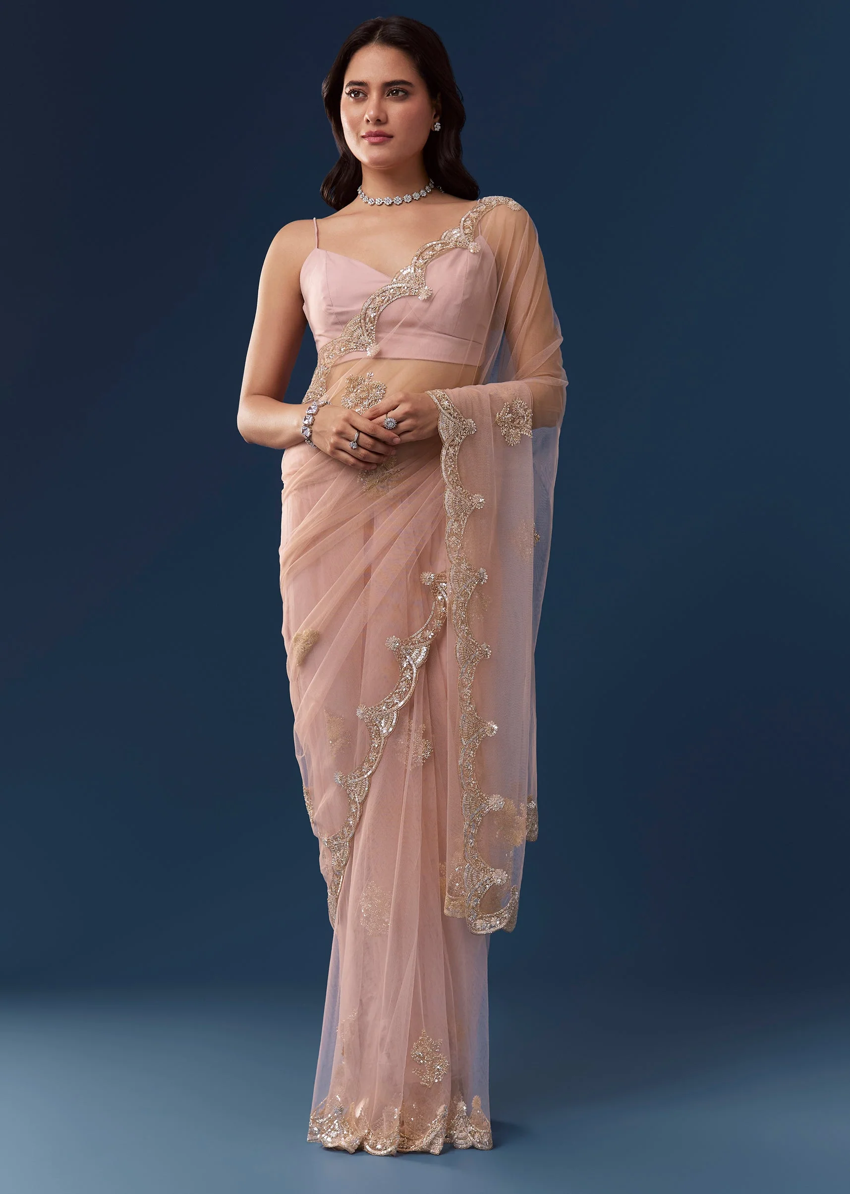 Peach Net Saree With Deep Scallop Border And Butti Embroidery