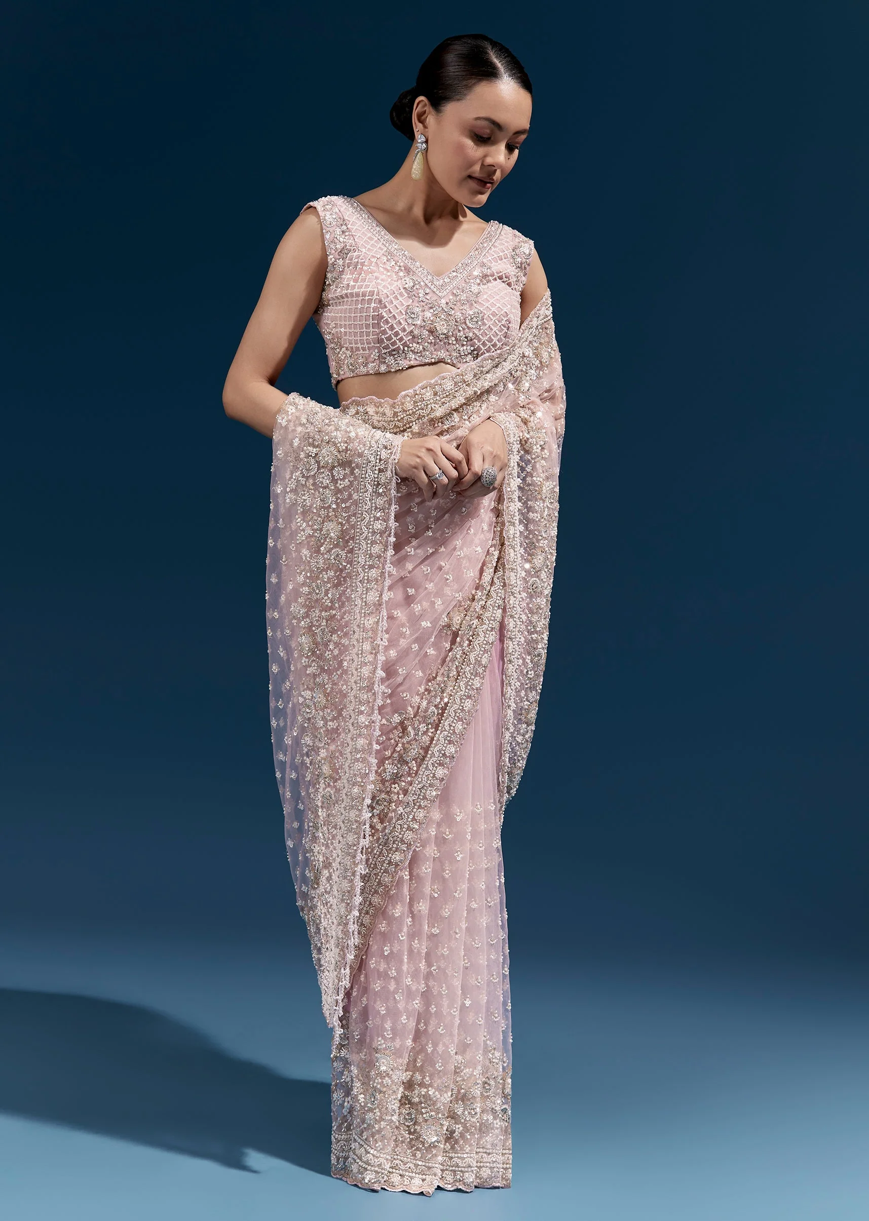 Pink Heavy Embroidered Net Saree With Scalloped Border And Tasselled Pallu