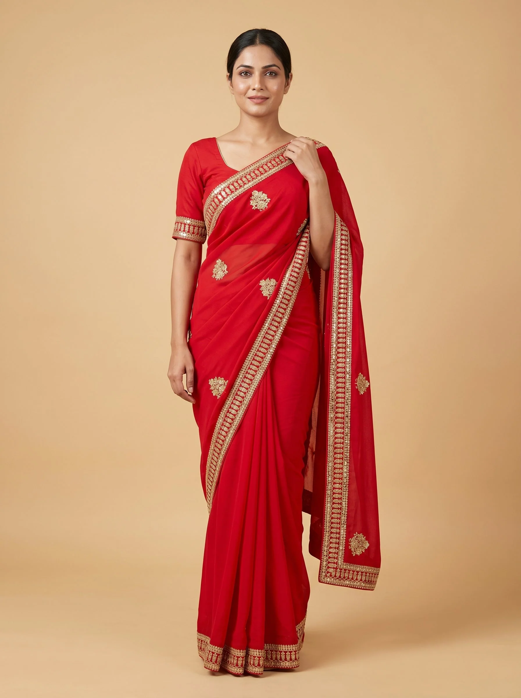 Red embroidered saree with traditional work