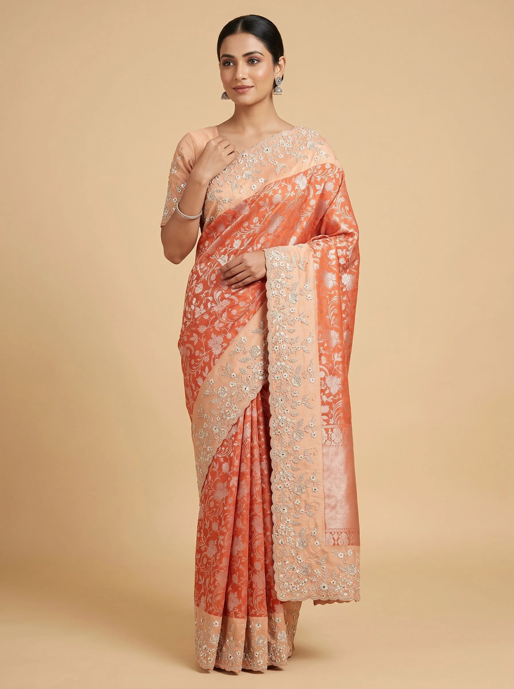 Rust embroidered saree with intricate detailing