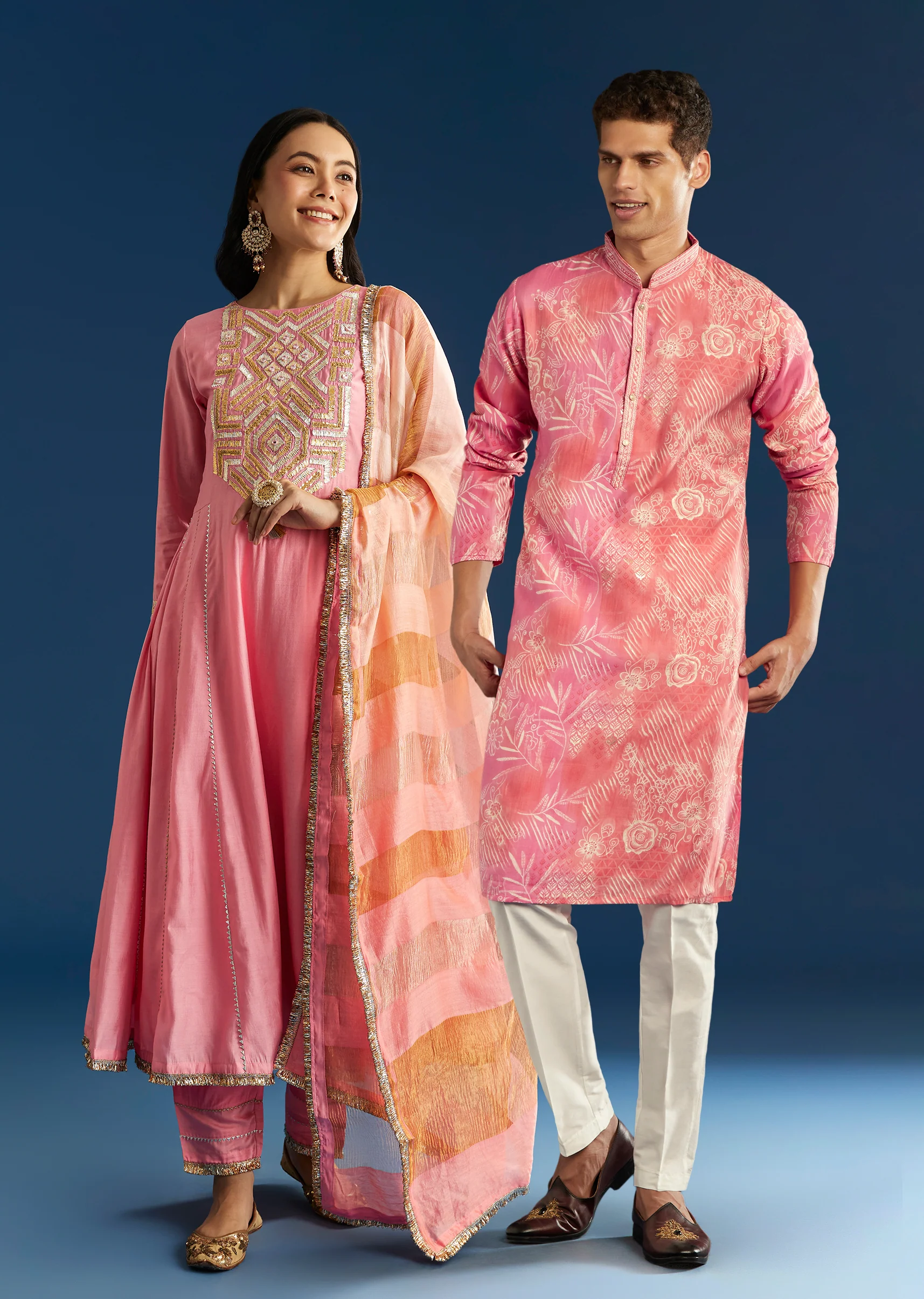 Soft Festive Couple Set – Pink Muslin Gotta Work Anarkali With Pant And Dupatta For Her And Pink Floral Print Art Silk Kurta Pant Set For Him